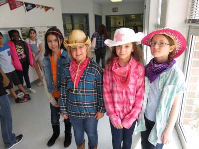 photo of fourth graders in cowboy outfits